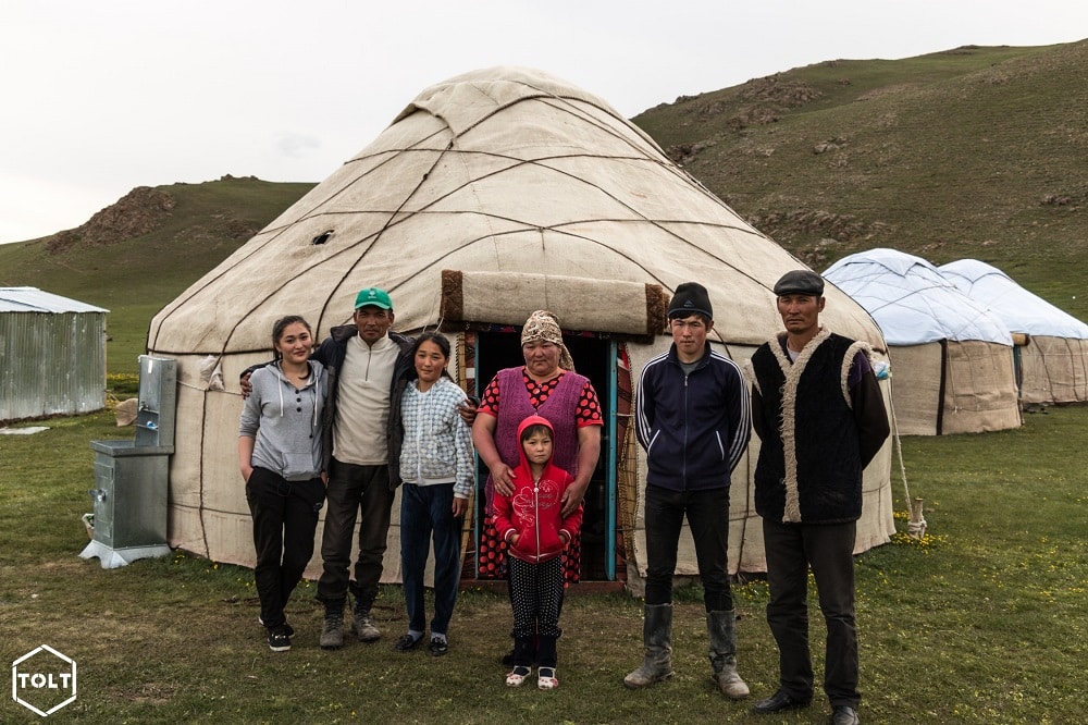 Kyrgyz family and their yurt