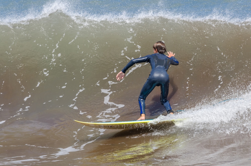 Surfing on the ocean waves. Mashico, Madeira island, Portugal.