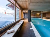 Studio au bord des pistes | Accès Piscine, Sauna, Casiers à ski et+