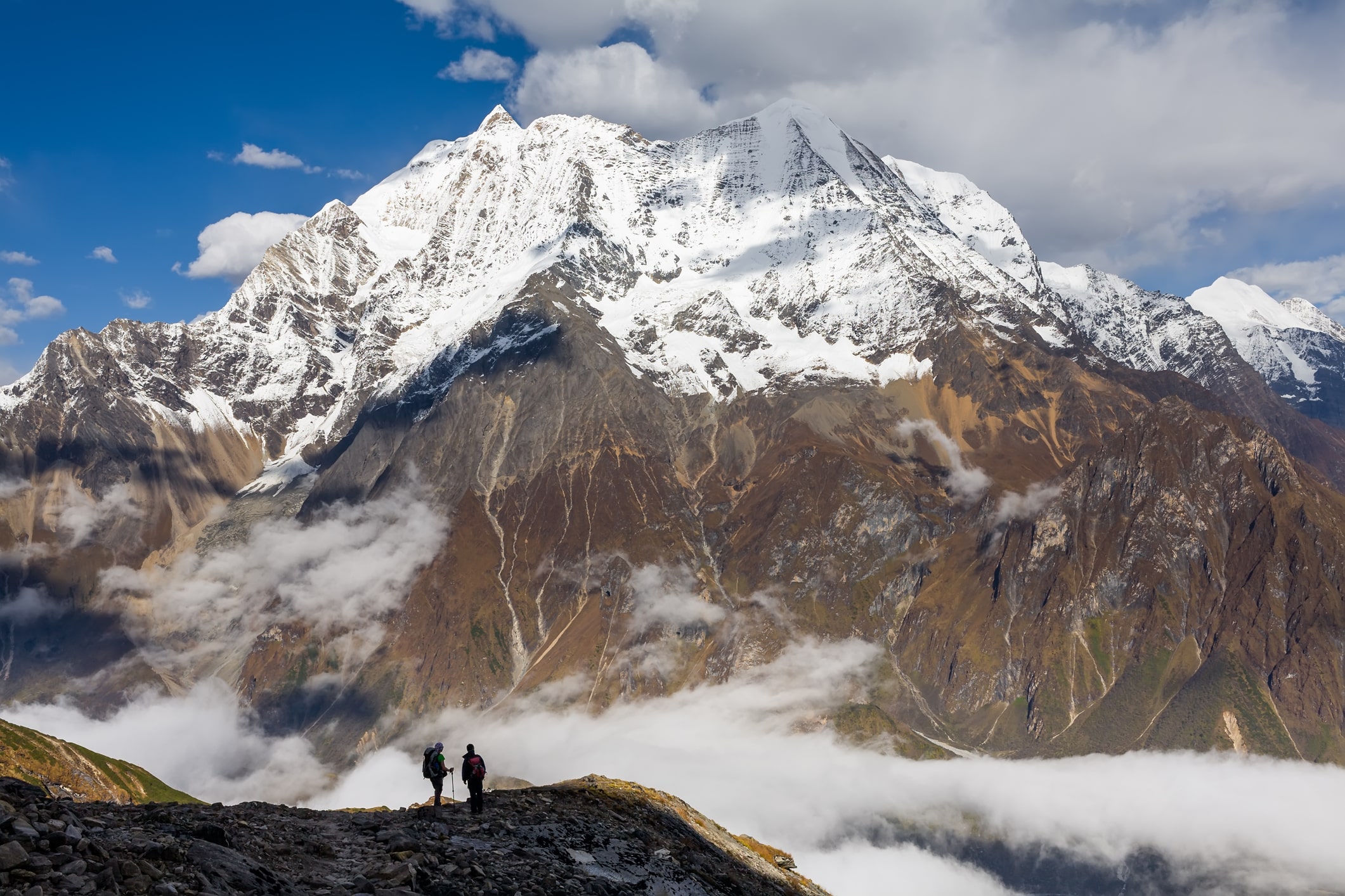 Trekker on the way to the valley covered with cloud on Manaslu circuit trek in Nepal