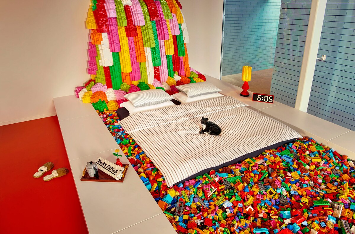 Meanwhile, parents get to sleep in a bed that floats in a pool filled with DUPLO bricks