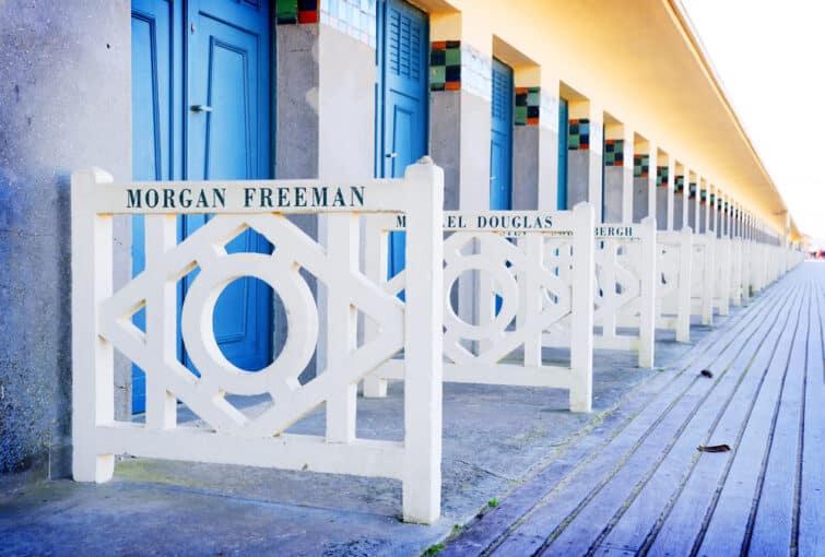 DEAUVILLE, FRANCE - Promenade des Planches, where beach closet are dedicated to famous actors to Deauville, France