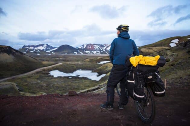 Biker enjoying a mountain bike ride around volcanic mountains in Iceland