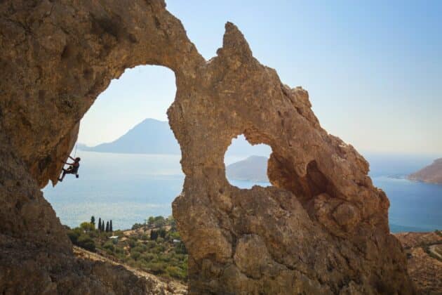 Senior female rock climber on cliff