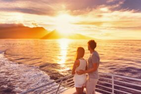 Couple enjoying sunset on a Mediterranean cruise