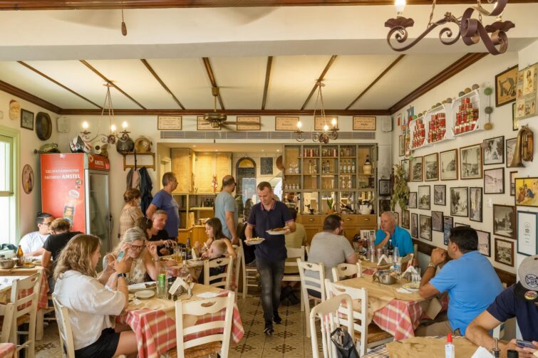 Interior of local gift shop in Zakynthos, Greece showcasing handmade crafts and colorful souvenirs